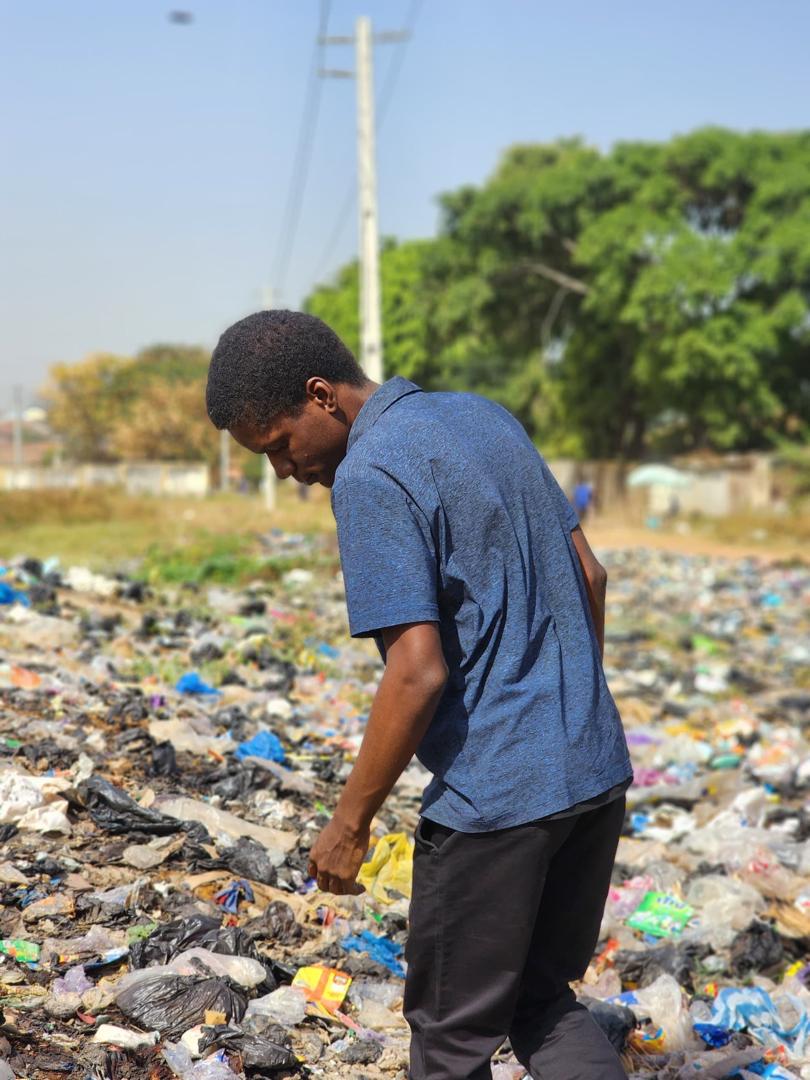 Dave standing around single-use plastic waste
