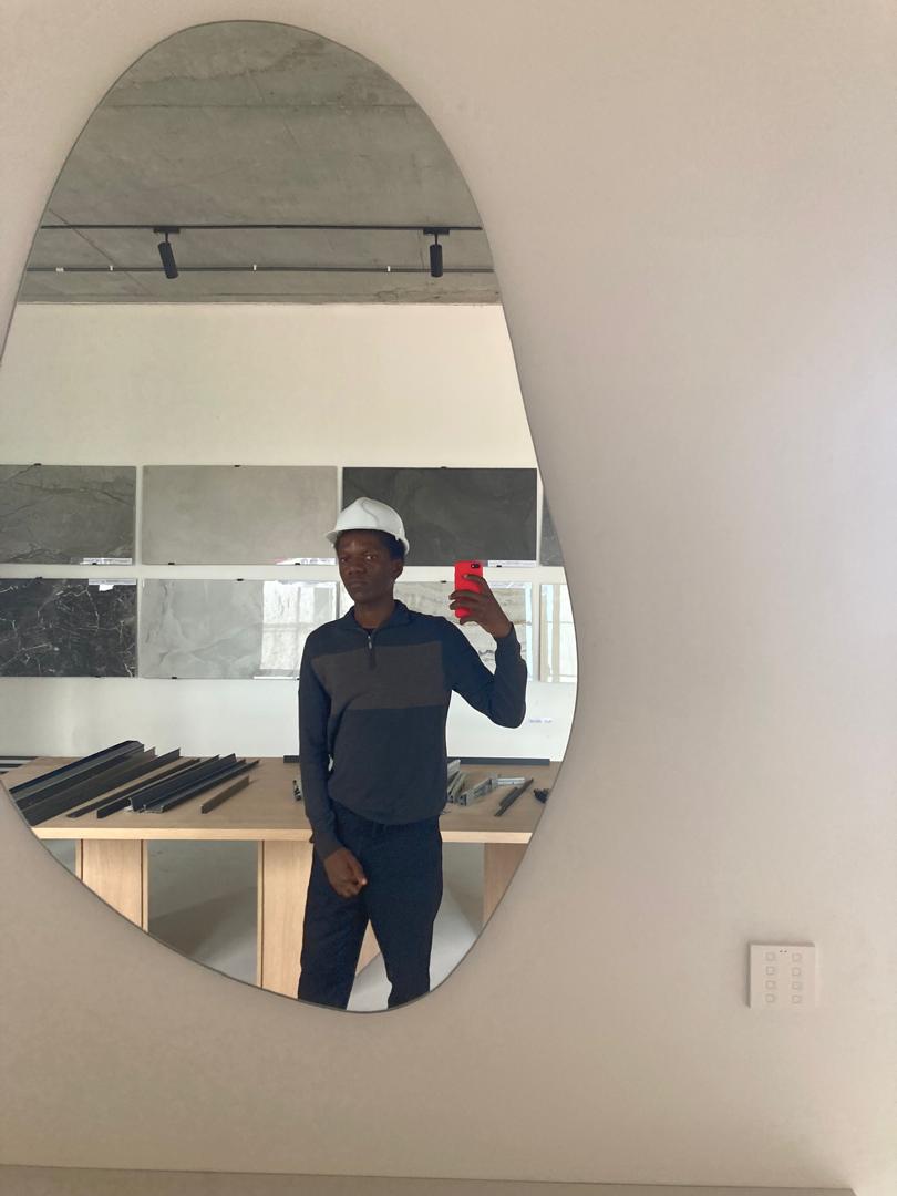 Dave in a sample room with a helmet